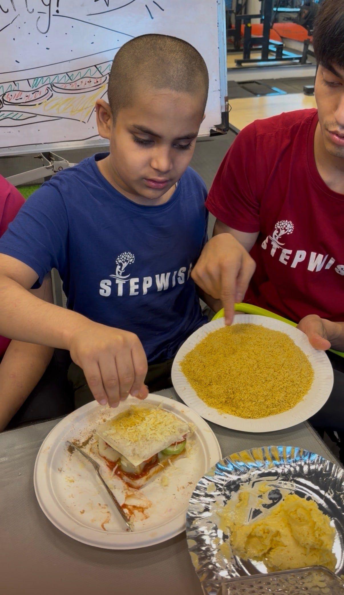 Students plating the food they prepared themselves